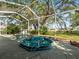 A screened in hot tub on the patio offers backyard views and access to outdoor living at 9355 French Quarters Cir, Weeki Wachee, FL 34613