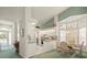 Bright kitchen with white cabinetry, breakfast nook, and ample natural light at 9355 French Quarters Cir, Weeki Wachee, FL 34613