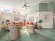 Inviting living room with high ceilings, decorative accents, and ample seating at 9355 French Quarters Cir, Weeki Wachee, FL 34613