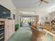 Comfortable living room with plush seating, open patio access, and bright natural light at 9355 French Quarters Cir, Weeki Wachee, FL 34613