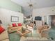 Spacious living area with sofas, decorative elements, and an open layout at 9355 French Quarters Cir, Weeki Wachee, FL 34613