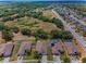 Aerial view showcasing homes with pools and well-manicured lawns in a residential area at 10106 Tolman Dr, Hudson, FL 34667