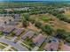 An aerial view of houses that back up to a natural area, highlighting the proximity to nature at 10106 Tolman Dr, Hudson, FL 34667