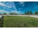 Large backyard with lush grass and a white fence offers privacy and plenty of play space at 10106 Tolman Dr, Hudson, FL 34667