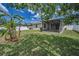 Lush backyard with beautiful landscaping, offering a private outdoor retreat at 10106 Tolman Dr, Hudson, FL 34667