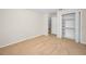 Bedroom features carpeting, neutral paint, and closet with built in shelves at 10106 Tolman Dr, Hudson, FL 34667