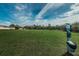 A spacious green community dog park for residents to exercise and socialize their pets at 10106 Tolman Dr, Hudson, FL 34667
