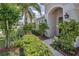 Close-up of home entrance, featuring the front door, landscaping, and walkway at 10106 Tolman Dr, Hudson, FL 34667