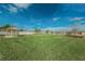 An expansive grassy common area with a gazebo, enclosed by a white fence, offering a serene outdoor space at 10106 Tolman Dr, Hudson, FL 34667