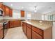 Open kitchen with stainless steel appliances, granite countertops, and an island at 10106 Tolman Dr, Hudson, FL 34667