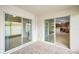 Covered lanai with tile flooring, offering a seamless transition to the interior living spaces at 10106 Tolman Dr, Hudson, FL 34667