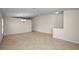 Open-concept living room features neutral walls and wood-look tile flooring throughout the home at 10106 Tolman Dr, Hudson, FL 34667