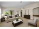Bright and airy living room with neutral colors, elegant furniture, and sliding doors to the outdoors at 10106 Tolman Dr, Hudson, FL 34667