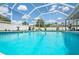 Inviting pool with screened enclosure, surrounded by lush landscaping and plenty of sunshine at 10235 Skyland St, Spring Hill, FL 34608