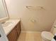 A half bathroom that includes a toilet and sink at 10238 Perthshire Cir, Land O Lakes, FL 34638