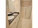 Bright bathroom featuring a double sink vanity and a glass-enclosed shower at 10238 Perthshire Cir, Land O Lakes, FL 34638
