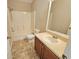 Bathroom featuring a vanity with a large mirror, a toilet, and a shower/tub combination at 10238 Perthshire Cir, Land O Lakes, FL 34638
