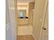 Bathroom with double sink vanity and a glass-enclosed shower at 10238 Perthshire Cir, Land O Lakes, FL 34638