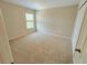 Neutral bedroom featuring neutral carpeting, one window, and a large closet at 10238 Perthshire Cir, Land O Lakes, FL 34638