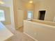 Upstairs hallway shows the entrance to a bathroom and bedroom at 10238 Perthshire Cir, Land O Lakes, FL 34638