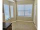 Sunny kitchen nook featuring neutral tile flooring and views through large windows at 10238 Perthshire Cir, Land O Lakes, FL 34638