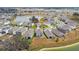 Panoramic aerial view of a suburban neighborhood with lush landscaping and ponds at 10823 Penny Gale Loop, San Antonio, FL 33576