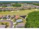 An aerial view of homes in a golf community with lush greenery and water features, offering a serene and picturesque setting at 1119 Dustan Pl, Trinity, FL 34655
