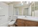 Bathroom features a tub-shower combination, laminate flooring, and single-sink vanity at 1119 Dustan Pl, Trinity, FL 34655