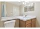 Bathroom vanity with a single sink, medicine cabinet and toilet with white countertop at 1119 Dustan Pl, Trinity, FL 34655