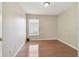 Neutral bedroom has vinyl flooring, one window, and blank walls at 1119 Dustan Pl, Trinity, FL 34655