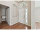 Inviting foyer features wood floors and a charming arched window above the front door at 1119 Dustan Pl, Trinity, FL 34655