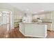 A spacious kitchen with granite countertops, island with sink, and a breakfast nook at 1119 Dustan Pl, Trinity, FL 34655
