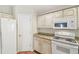 A close-up view of the kitchen, showcasing the appliances and cabinets at 1119 Dustan Pl, Trinity, FL 34655