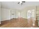 Large living room with wood floors, arched doorways, and neutral paint colors at 1119 Dustan Pl, Trinity, FL 34655