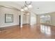 Spacious living room boasting wood floors, arched doorways, large windows, and elegant lighting fixtures at 1119 Dustan Pl, Trinity, FL 34655