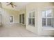 Covered patio with shuttered windows, providing a comfortable outdoor living area at 1119 Dustan Pl, Trinity, FL 34655