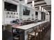 An inviting bar with well-stocked shelves, marble countertop, and comfortable seating at 11213 Brooklawn Dr, Hudson, FL 34667