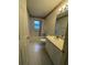 Bathroom with a tub and shower combination and a vanity offering counter space at 11213 Brooklawn Dr, Hudson, FL 34667