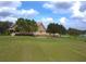 The Heritage Pines clubhouse offers golf course views, manicured lawns, and mature trees at 11213 Brooklawn Dr, Hudson, FL 34667