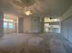 Open-concept living room with a view into the kitchen area perfect for entertaining guests at 11213 Brooklawn Dr, Hudson, FL 34667