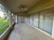 A relaxing screened patio with tiled floor and sliding glass doors offers indoor-outdoor living at 11213 Brooklawn Dr, Hudson, FL 34667