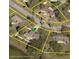 An aerial view showing the property's location, and proximity to nearby neighborhood streets at 1127 Lodge Cir, Spring Hill, FL 34606