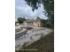 Large backyard featuring a pool and a concrete patio area great for entertaining at 1127 Lodge Cir, Spring Hill, FL 34606