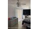 Bright bedroom with tile flooring, a dresser, a bed, and natural light at 1127 Lodge Cir, Spring Hill, FL 34606
