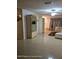 Bright living room features tile flooring and neutral paint color with plenty of space for entertaining at 1127 Lodge Cir, Spring Hill, FL 34606