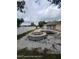 A backyard showcasing an in-ground pool with a built-in spa, ready for renovation and enjoyment at 1127 Lodge Cir, Spring Hill, FL 34606