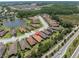 An aerial view of a planned community with many single Gathering homes surrounding several ponds and lush Florida landscaping at 11325 Juglans Dr, Odessa, FL 33556