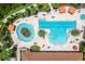Aerial view of community pools, lounge areas, and lush landscaping, offering a resort-style experience at 11325 Juglans Dr, Odessa, FL 33556