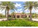 Luxurious clubhouse with palm trees and beautiful landscaping at this community at 11325 Juglans Dr, Odessa, FL 33556