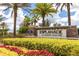 Esplanade at Starkey Ranch community sign surrounded by colorful flowers and greenery at 11325 Juglans Dr, Odessa, FL 33556